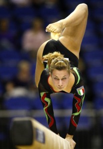 Armi from Italy performs her routine on the beam during the World Gymnastic Championships in London